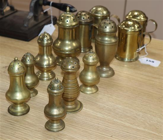 Twelve Georgian brass sugar, salt and pepper shakers